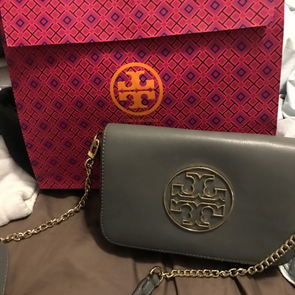 Beautiful designer bag.  Real leather and a beautiful dark gray color.